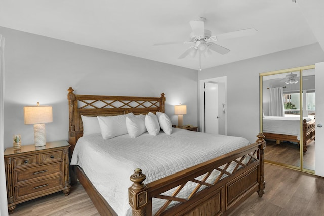 bedroom featuring hardwood / wood-style flooring, ceiling fan, and a closet