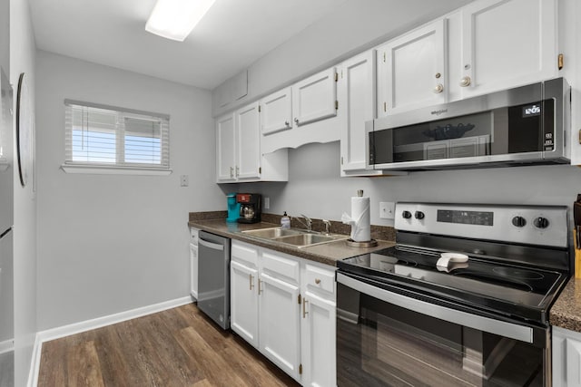 kitchen featuring white cabinetry, sink, and appliances with stainless steel finishes