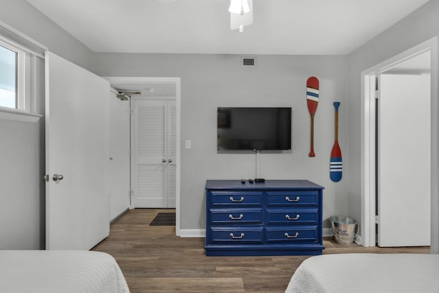 bedroom featuring dark wood-type flooring