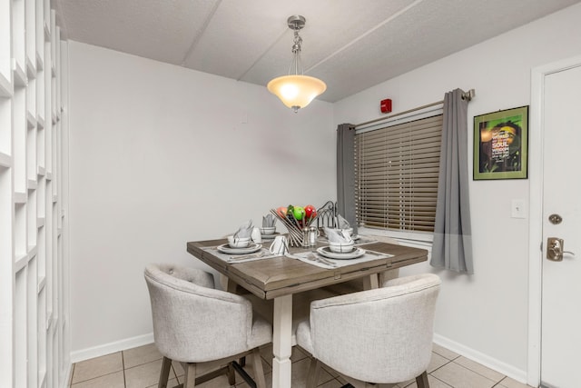 dining space with light tile patterned floors