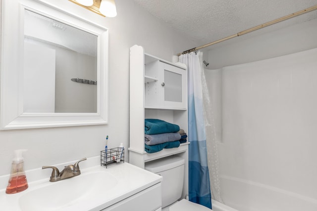 full bathroom featuring a textured ceiling, toilet, vanity, and shower / bathtub combination with curtain