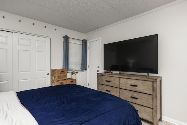 bedroom featuring a textured ceiling and ornamental molding