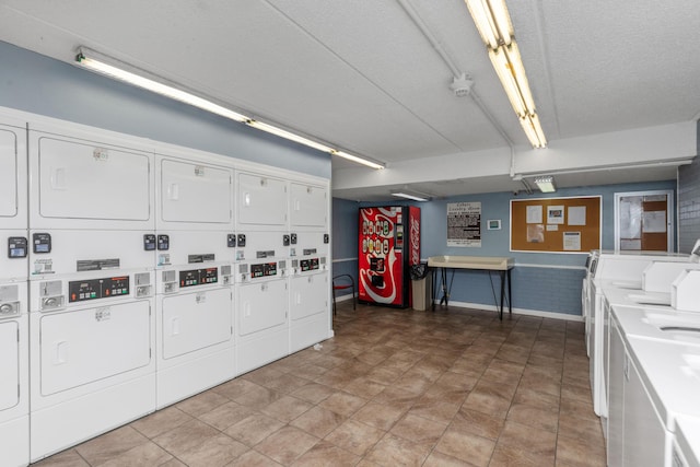 clothes washing area with washing machine and dryer and stacked washer / drying machine