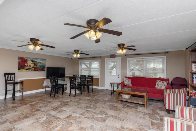 living room featuring ornamental molding and a textured ceiling