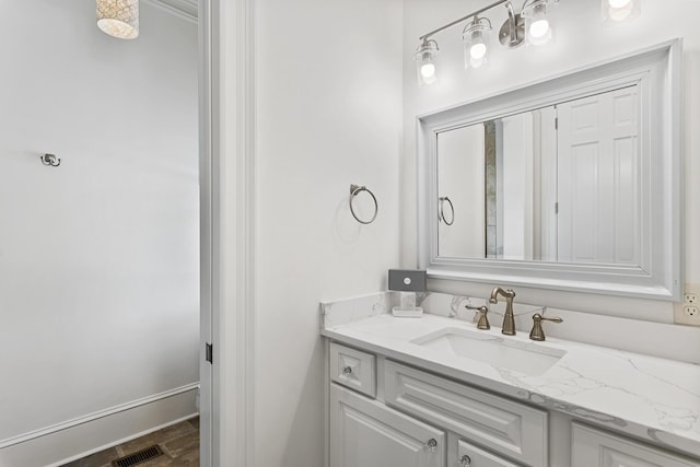 bathroom featuring vanity and hardwood / wood-style flooring