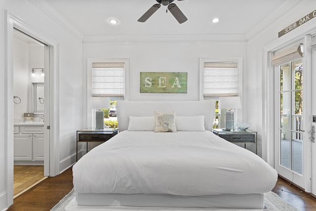 bedroom with multiple windows, crown molding, and access to outside