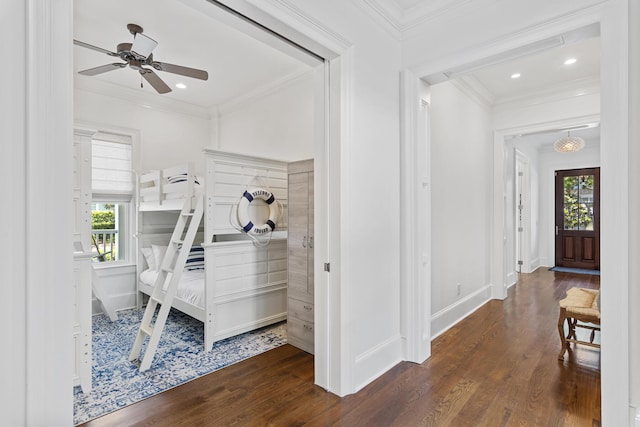 interior space featuring crown molding, dark hardwood / wood-style floors, and a wealth of natural light