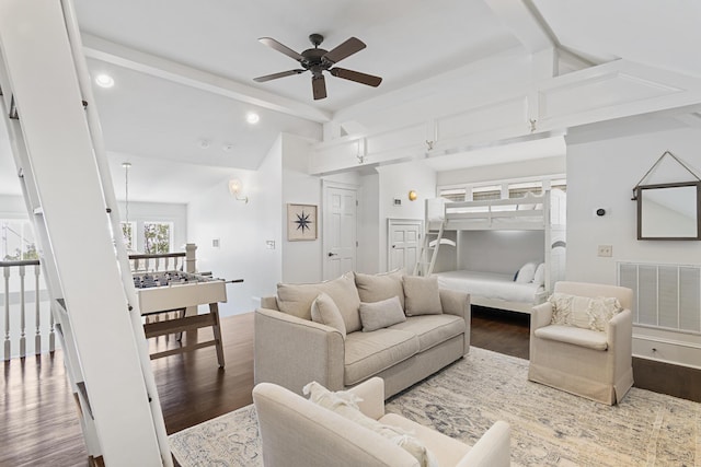 living room with lofted ceiling with beams, hardwood / wood-style floors, and ceiling fan