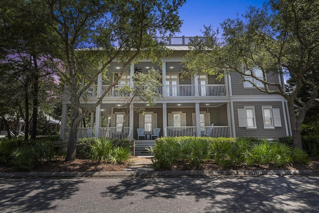 view of front of house with a balcony and covered porch