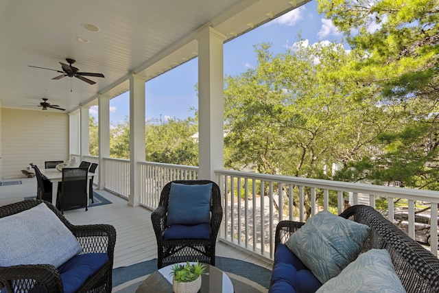 exterior space featuring outdoor lounge area and ceiling fan