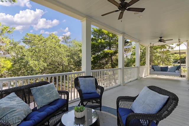 wooden terrace featuring an outdoor hangout area and ceiling fan