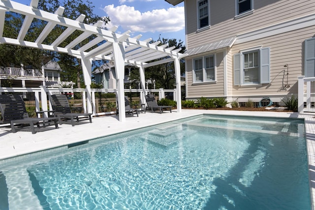 view of pool featuring a pergola and a patio