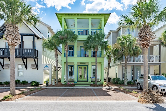 view of front of house featuring a balcony