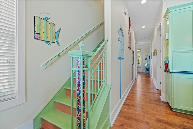 hallway with light hardwood / wood-style floors
