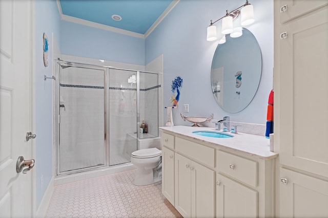 bathroom with ornamental molding, vanity, an enclosed shower, and toilet