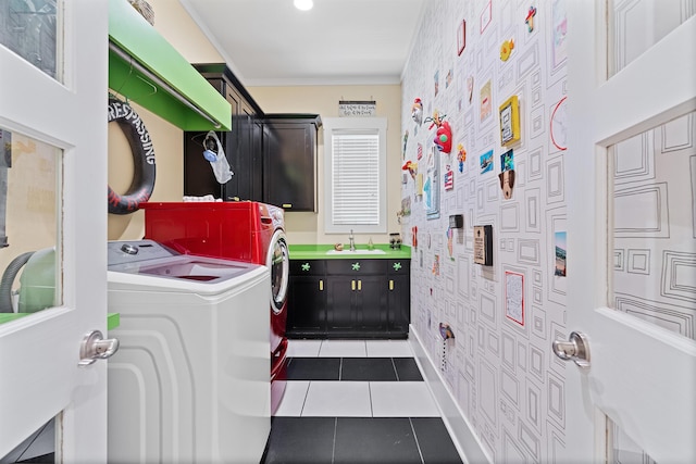 clothes washing area with sink, washing machine and clothes dryer, and tile patterned floors