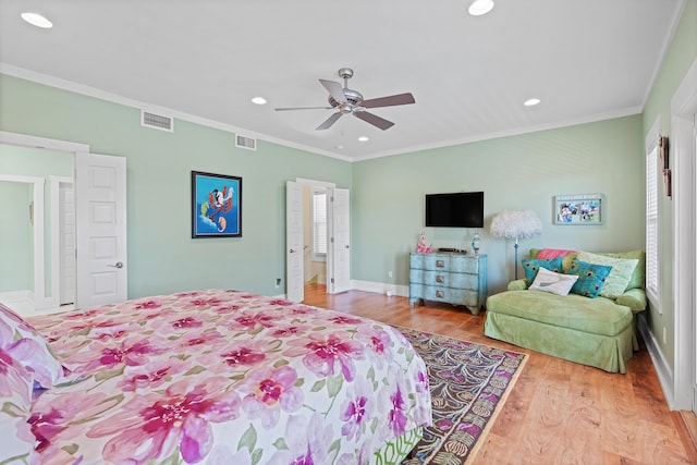 bedroom featuring light wood-type flooring, ceiling fan, and ornamental molding