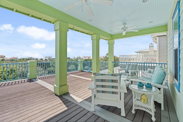 deck featuring an outdoor living space and ceiling fan