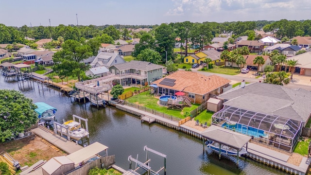 drone / aerial view with a water view and a residential view