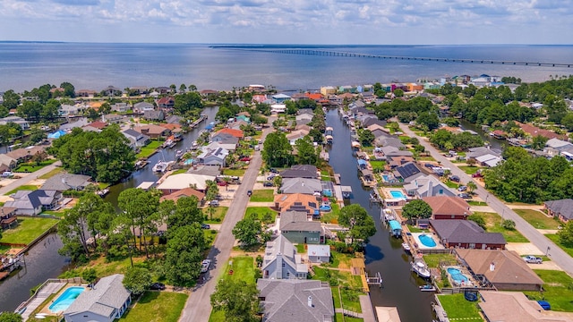 bird's eye view featuring a residential view and a water view