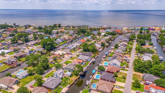 drone / aerial view with a residential view and a water view