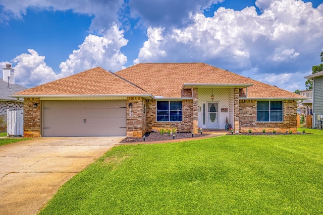 single story home with a garage, a front yard, concrete driveway, and brick siding