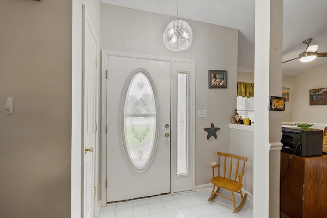 entrance foyer with ceiling fan