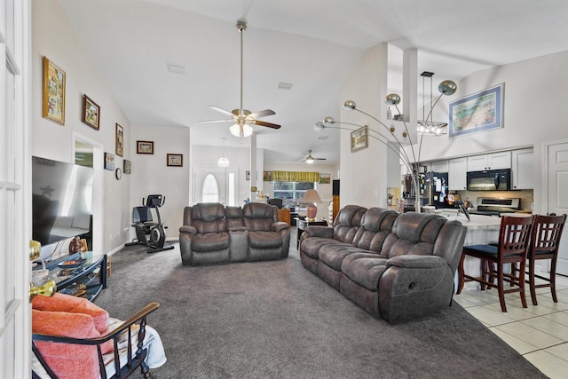 living area with light tile patterned floors, high vaulted ceiling, and light colored carpet