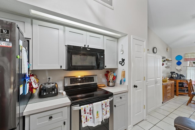 kitchen with stainless steel appliances, white cabinets, light countertops, and light tile patterned floors