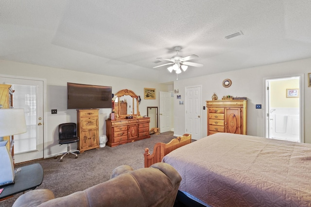 carpeted bedroom featuring a textured ceiling, ceiling fan, visible vents, and ensuite bathroom