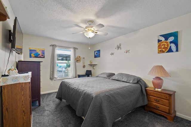 bedroom featuring dark carpet, a textured ceiling, and baseboards