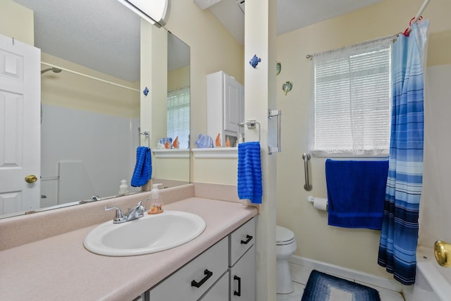 full bath featuring toilet, tile patterned flooring, a wealth of natural light, and vanity