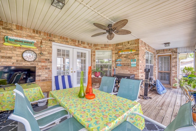 exterior space with ceiling fan, wooden ceiling, brick wall, wood finished floors, and french doors