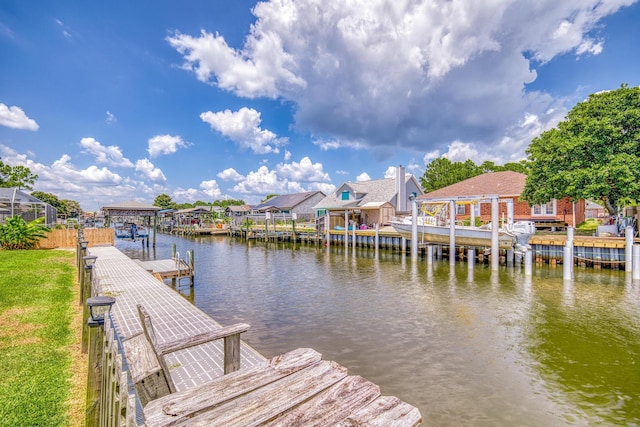 dock area with a water view and a residential view