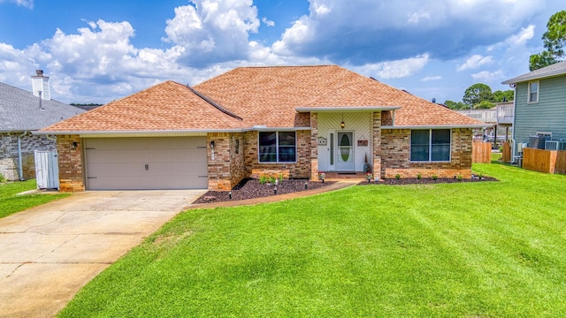 ranch-style house featuring a garage, a front lawn, and brick siding