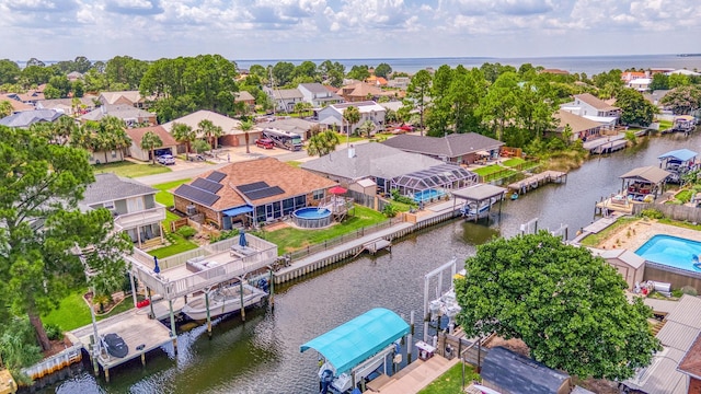 birds eye view of property featuring a water view and a residential view