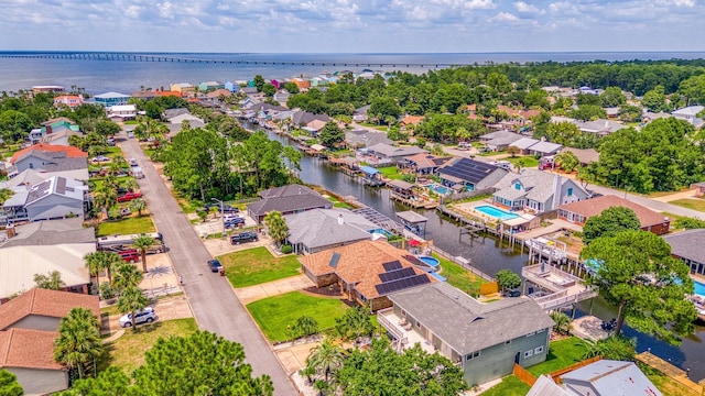 birds eye view of property featuring a residential view and a water view