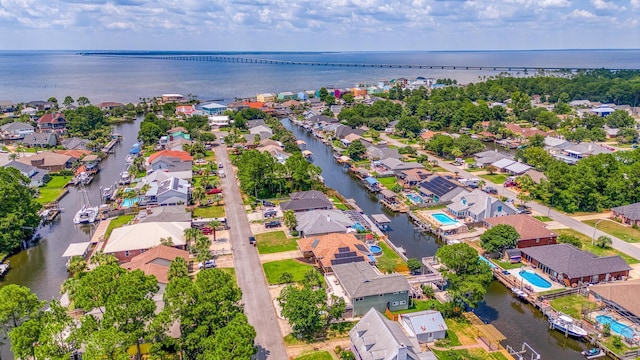 bird's eye view with a residential view and a water view