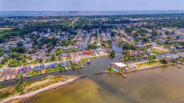 drone / aerial view featuring a water view and a residential view