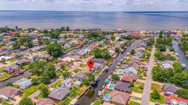 birds eye view of property with a residential view and a water view