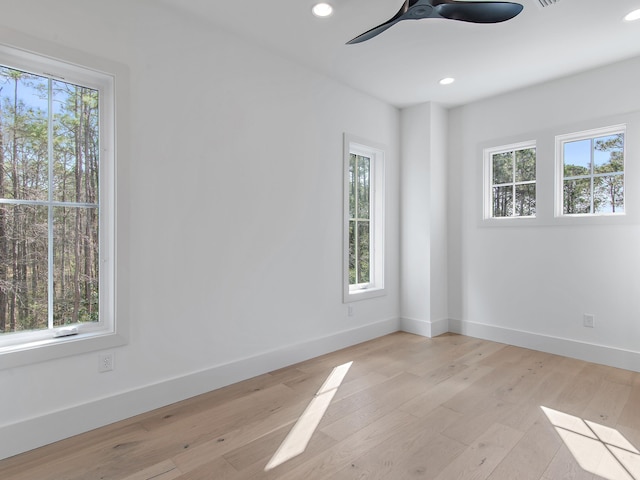 spare room featuring ceiling fan and light wood-type flooring