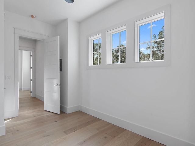 unfurnished bedroom featuring light wood-type flooring