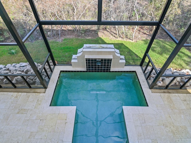 view of pool featuring a lawn