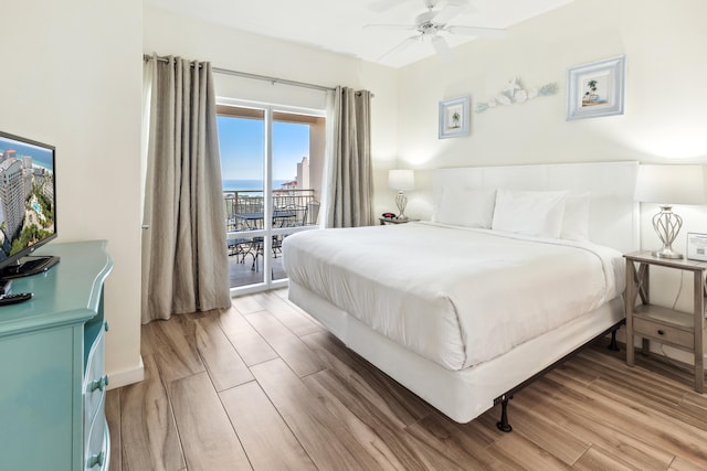 bedroom featuring access to exterior, ceiling fan, and light hardwood / wood-style flooring