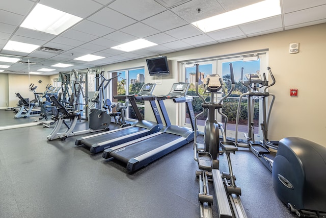 exercise room with a drop ceiling