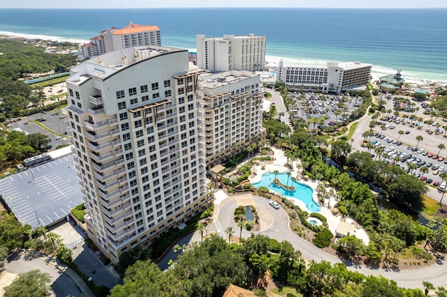 bird's eye view featuring a view of the beach and a water view