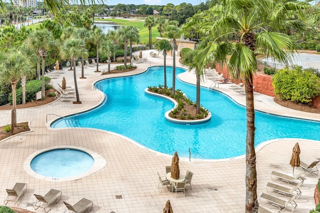 view of pool with a community hot tub and a patio area