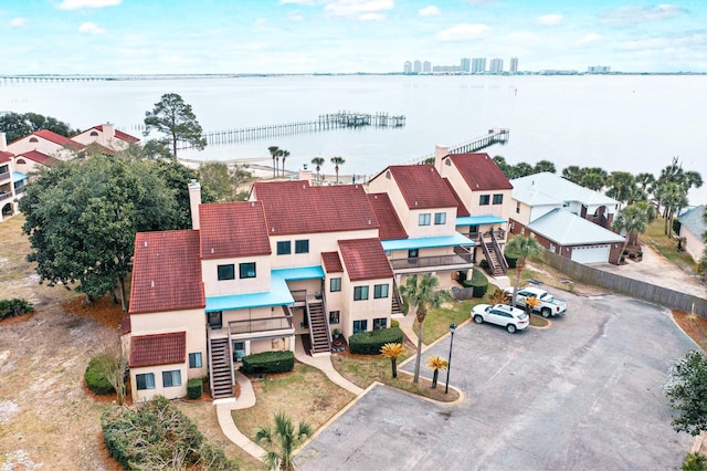 birds eye view of property with a water view