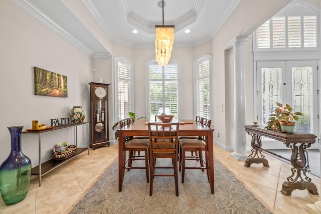 503 Regatta Bay Blvd, Destin, FL 32541 - dining room with light tile patterned floors, decorative columns, a raised ceiling, crown molding, and recessed lighting