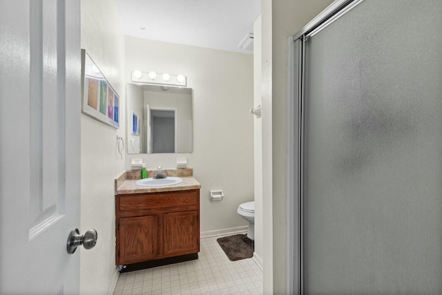 bathroom with walk in shower, vanity, and toilet